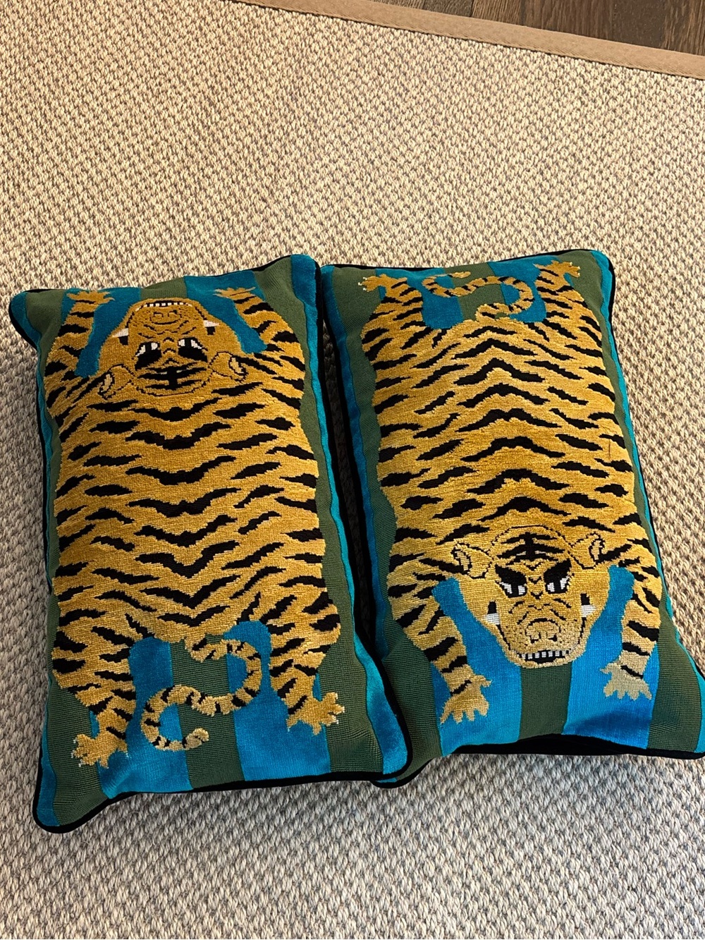 Schumacher Jokhang Tiger Velvet pillows in the Peacock and Olive colorway
